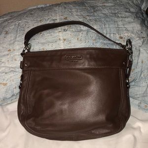 Brown medium sized coach bag with blue interior